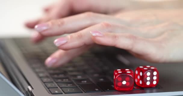 Online gambling and hand work on laptop keyboard — Stockvideo
