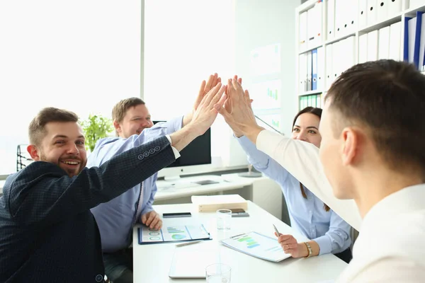 Colleagues give high five in order to celebrate successful contract, good news — Stok Foto