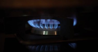 Blue flame burning on gas burner closeup 4k movie
