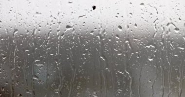 Large rain drops on glass closeup 4k movie