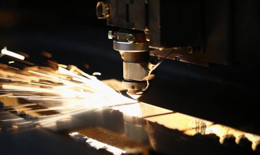 Neon sparks fly out machine head, equipment for metal processing laser metal