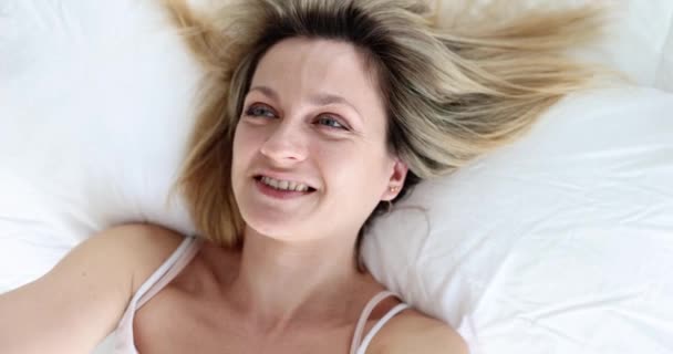 Happy Woman Takes Selfie While Lying Bed Close Hand Held — Stock video