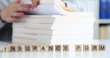 Insurance agent is looking for client insurance form. Insurance form archive and paperwork concept
