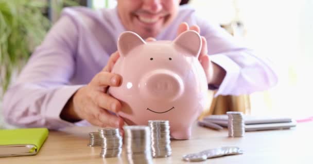 Smiling Businesswoman Strokes Shakes Piggy Bank Coins Financial Investment Growth — Stockvideo