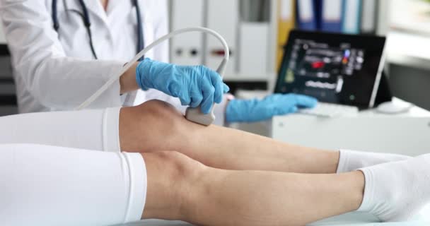 Doctor Makes Ultrasound Knee Joint Woman Using Ultrasound Scanner Clinic — Stock Video