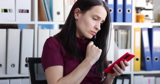 Sad Young Woman Looks Smartphone Screen Reading Bad Disturbing News — Video