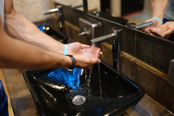 Man Washes Hands Sink Bathroom Home Checking Temperature Touching Running — Stock fotografie