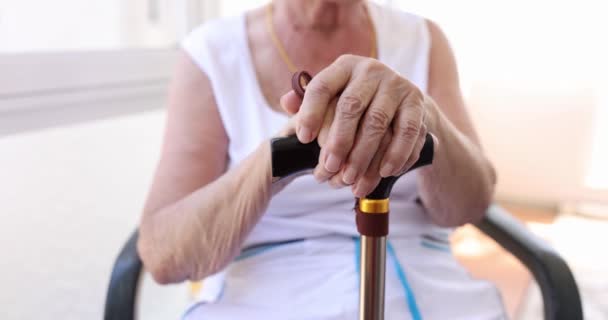 Pensioner Sitting Chair Leans Cane Close Shallow Focus Wrinkled Skin — Vídeos de Stock