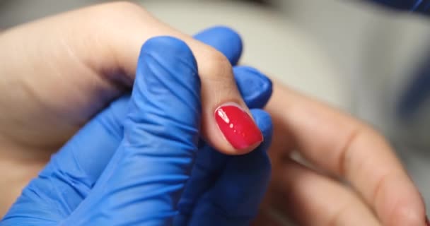 Manicurist Applies Red Lacquer Womans Finger Close Manicure Correction Cosmetic — Vídeo de stock