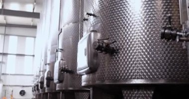 Line of industrial chemical tanks in chemical-pharmaceutical production. Petrochemical industry or wine industry