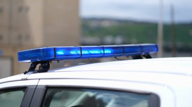 Closeup of blue lights on roof of police car. Police car flashing lights and police car siren