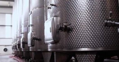 Complex technological industrial equipment in winery or production equipment of chemical and pharmaceutical industries. Large metal tanks in production