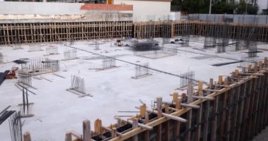 Precast concrete slabs and metal bars outdoors at construction site. Construction building concept
