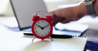 Person works on computer as remote freelancer or blogger. Working time deadline and time management concept