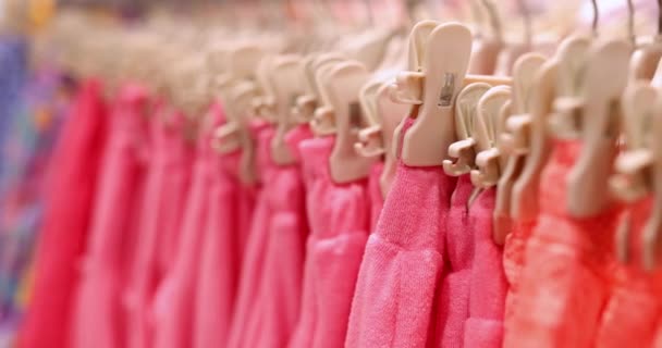Bright Pink Women Shorts Pants Hanging Hangers Rack Clothing Store — Stockvideo