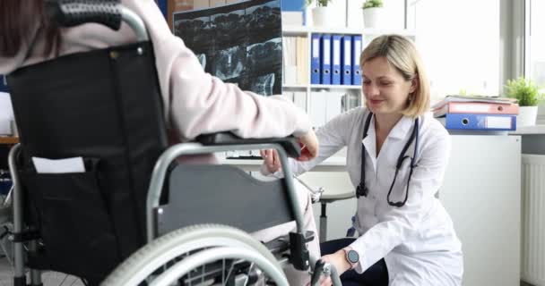 Doctor Explaining Ray Results Patient Wheelchair Hospital Testing Sensitivity Legs — Vídeos de Stock