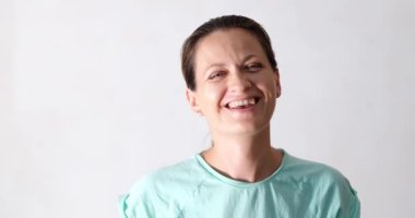 Cheerful pretty woman looks at camera and laughs. Happy young joyful beautiful lady closeup portrait
