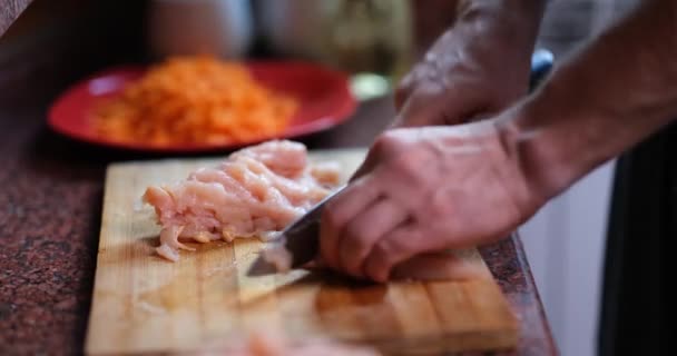 Male Hands Knife Cuts Tender Turkey Fillet Chicken Meat Wooden — Stockvideo