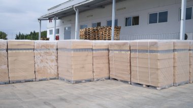Rows of boxes and pallets in a warehouse and production warehouse. Warehouse storage of finished products concept