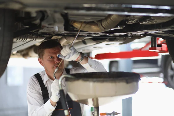 Auto Mechanic Checks Running Gear Car Oil Leak Service Station — Stok fotoğraf