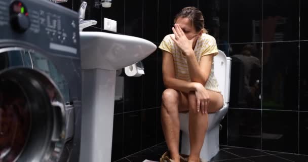 Thoughtful Woman Sits Toilet Home Bathroom Black Tiles Difficult Defication — Videoclip de stoc