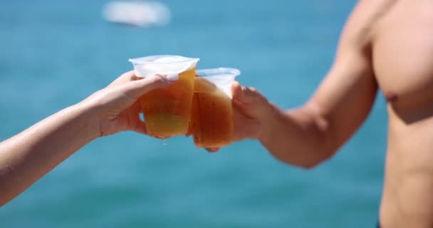 Closeup Hands Cold Glasses Beer Clink Background Sea Couple Men — Stockvideo