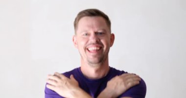 Portrait of cheerful happy man dancing towards camera. Emotions of joy of success and positive mood