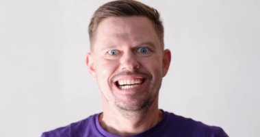 Portrait of screaming emotionally angry young man. Negative emotions and male aggression