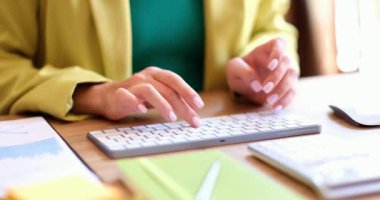 Closeup of businesswoman hands on computer keyboard on desk at home or in office. Concept of remote work as tester programmer or freelancer
