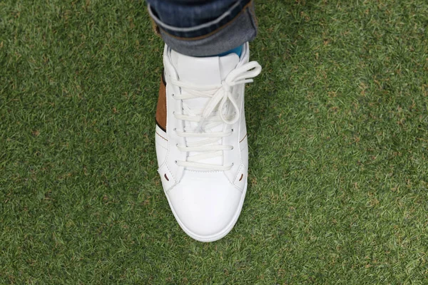 Man Wearing White Sneakers Green Lawn Grass Stylish Trendy Sports — стоковое фото