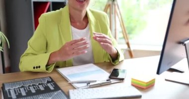 Businesswoman marketer manager explains financial business indicators with hand gestures. Boss tells business working business process