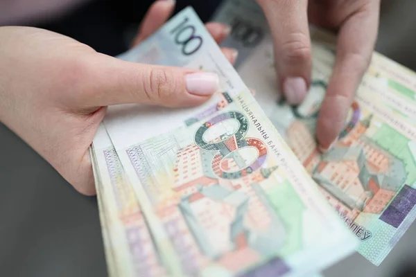 Womens hands are counting cash, close-up, blurry. Ruble banknotes, exchange. Concept devaluation, inflation