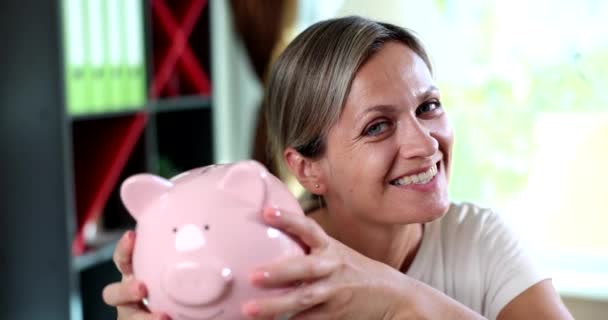 Emotionally Joyful Happy Woman Shakes Piggy Bank Family Savings Profitable — Stock Video