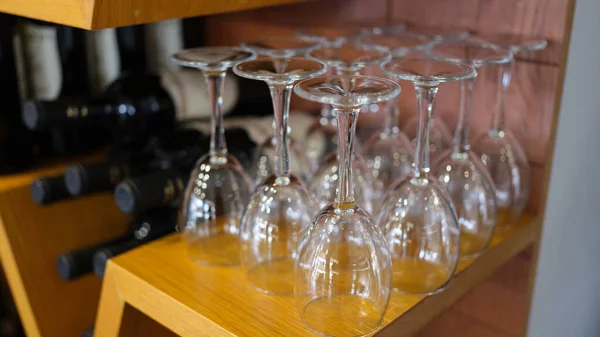 Wine bar with empty glasses and bottles of elite wine. Wine tasting and bottling