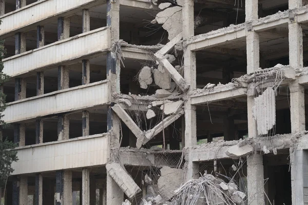 Debris and ruined building collapsed from earthquake. War and destruction building concept