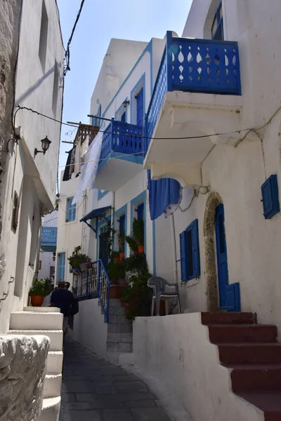 White houses with blue shutters, balconies, the traditional Greek village of Mandraki on the island of Nisyros
