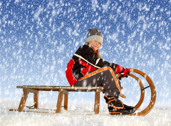Girl on a sleigh — Stock Photo, Image