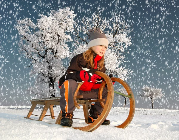 Girl on a sleigh — Stock Photo, Image