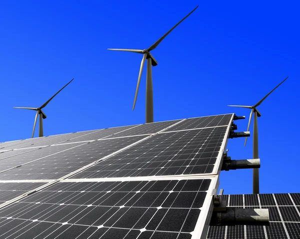 Solar energy panels and wind turbine — Stock Photo, Image