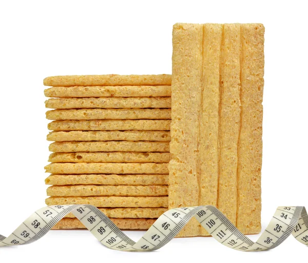 Wheat slices with measuring tape — Stock Photo, Image