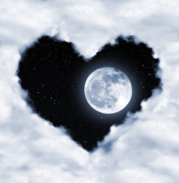 Heart from clouds on night sky with moon