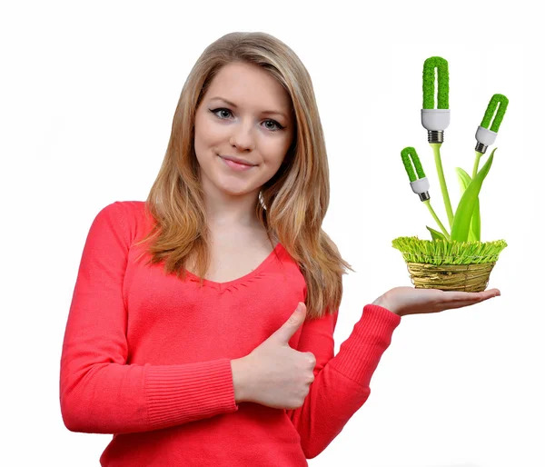 Chica sosteniendo en la mano bombillas de energía ecológica — Foto de Stock