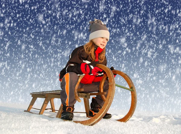 Girl on a sleigh — Stock Photo, Image