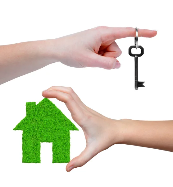 Green house with key in hands — Stock Photo, Image