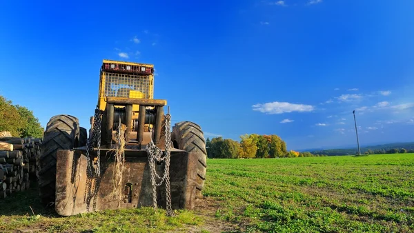 Digger on the field — Stock Photo, Image