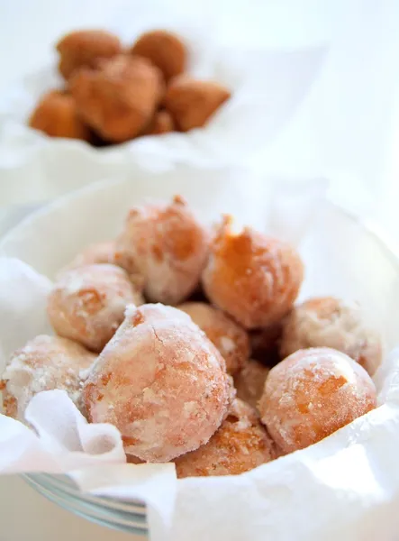 Fried donuts in a glass bowl. — Stock Photo, Image