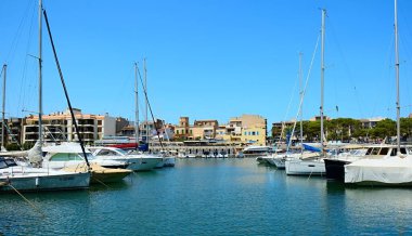 PORTO CRISTO, SPAIN - AUGUST 2, 2022: View of harbor of Porto Cristo town within the Manacor municipality in Majorca island, Spain.