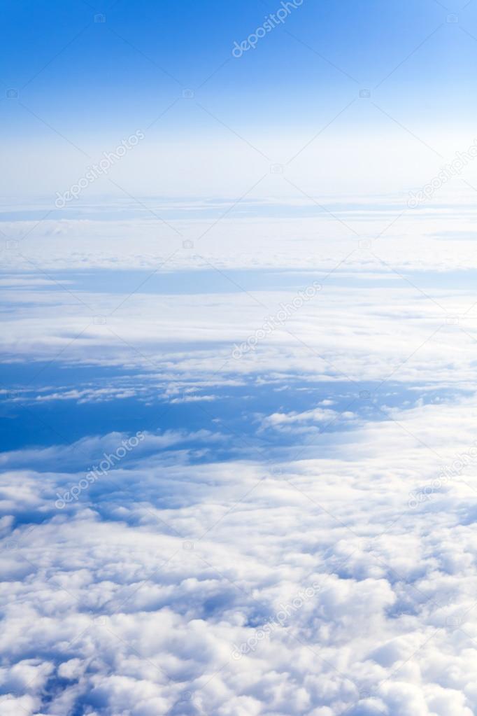 Flying over the clouds. The view from the airplane window