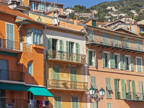 France , Cote d'Azur , Villefranche. Architectural detail of old houses on the waterfront. View from the sea . — Stock Photo, Image