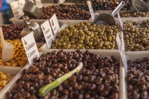 Eco-friendly products on a market stall . Various kinds of pickled olives — Stock Photo, Image